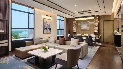 a living room with a couch and a table at Crowne Plaza Wuhan Development Zone by IHG in Wuhan