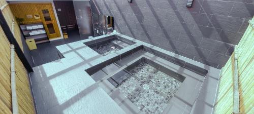 an overhead view of a pool in the middle of a building at REIWA INN APARTMENT in Hanoi