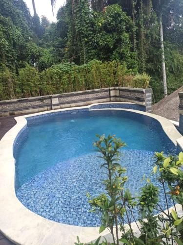The swimming pool at or close to Batu Agung Laplapan