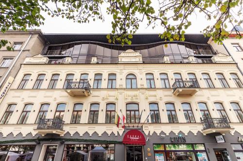 an old building in front of a street at Kaunas in Kaunas