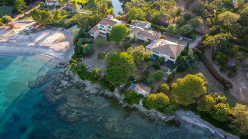 an aerial view of a house on a beach at Faounzina Village in Favone