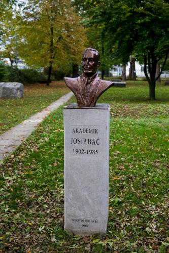 a statue of a bust of a man in a park at Hotel Bank in Kiseljak