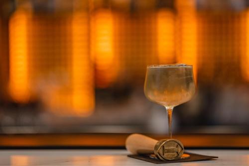 a glass of wine sitting on top of a table at InterContinental Malta by IHG in St Julian's