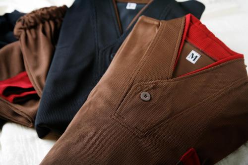 a close up of a suit and tie on a table at La Vista Daisetsuzan in Higashikawa