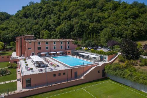 an aerial view of a building with a swimming pool at La Reggia Sporting Center Hotel in Cascia