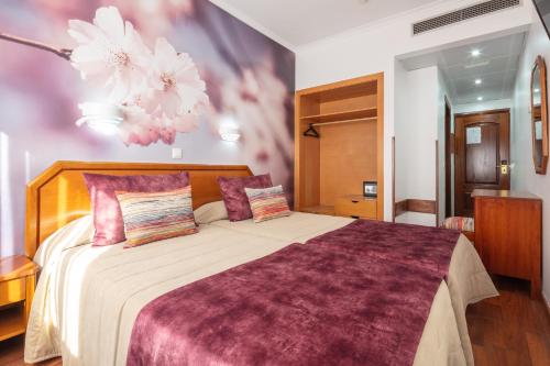 Postel nebo postele na pokoji v ubytování Hotel Anjos