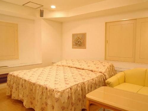 Postel nebo postele na pokoji v ubytování Hotel Fine Olive Sakai