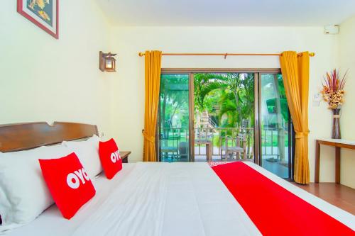 Postel nebo postele na pokoji v ubytování OYO 607 Nawang Resort