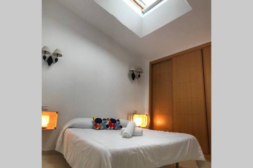 Posteľ alebo postele v izbe v ubytovaní Apartamento Ático Aviles