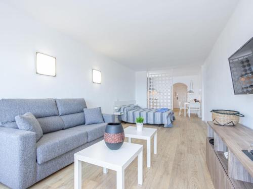 a living room with a couch and a table at Apartment Bahia I by Interhome in Empuriabrava