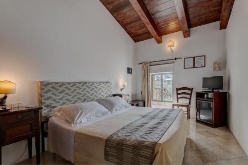 מיטה או מיטות בחדר ב-Hotel La Terra