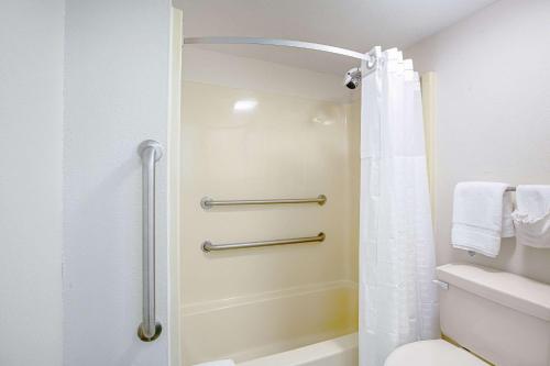 a bathroom with a shower and a toilet at Quality Inn & Suites Live Oak I-10 Exit 283 in Live Oak