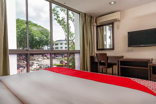 Afbeelding uit fotogalerij van Super OYO 90055 Mansion Inn in Sibu