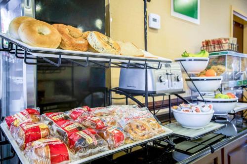 a shelf with bread and other food items on it at Comfort Inn & Suites Augusta Fort Eisenhower Area in Augusta