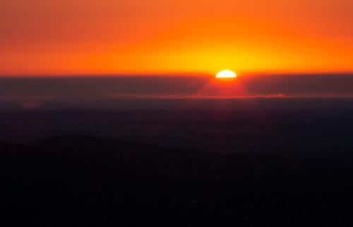 a sunset from the sky with the sun in the horizon at The Place at Evoramonte in Évora Monte
