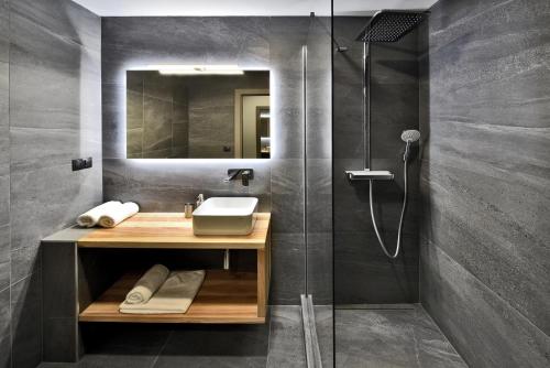 a bathroom with a sink and a shower at Apartmány Tri sestry Jasná in Demanovska Dolina