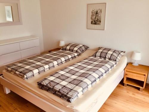 two beds sitting next to each other in a bedroom at Apartment Titliszentrum 2 by Interhome in Engelberg