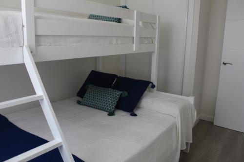 Ένα ή περισσότερα κρεβάτια σε δωμάτιο στο Apartamento en la playa Málaga