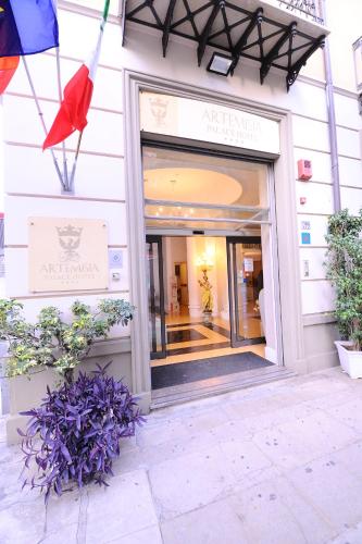 a store front of a building with a window at Artemisia Palace Hotel in Palermo