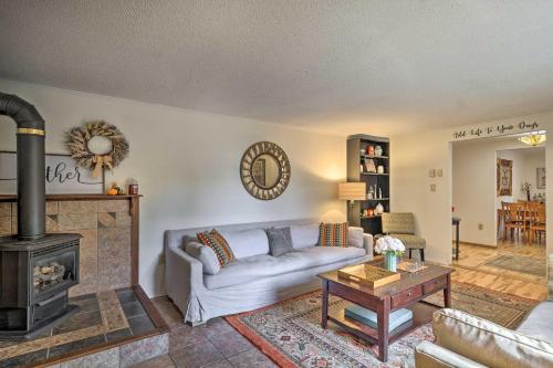 a living room with a couch and a fireplace at Woodsy Diamond Point Getaway - 5 Mi to Lake George in Diamond Point