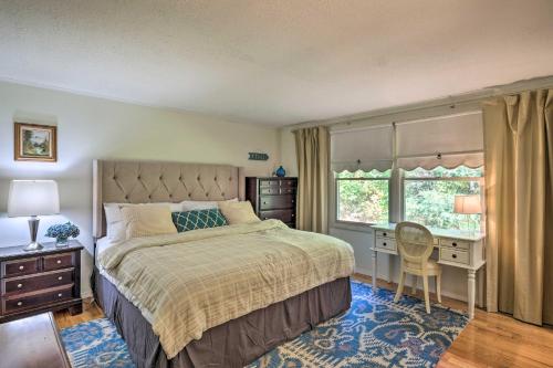 a bedroom with a bed and a desk and a window at Woodsy Diamond Point Getaway - 5 Mi to Lake George in Diamond Point