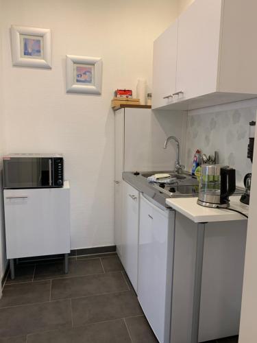 Η κουζίνα ή μικρή κουζίνα στο H&E Apartments