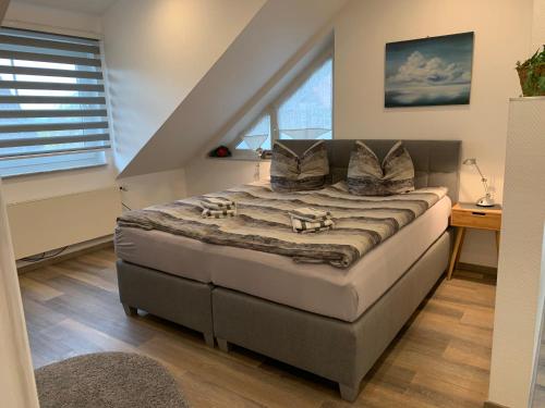 Ένα ή περισσότερα κρεβάτια σε δωμάτιο στο H&E Apartments