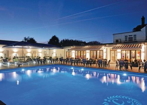 a large swimming pool in front of a building at Foxhunter Park in Minster