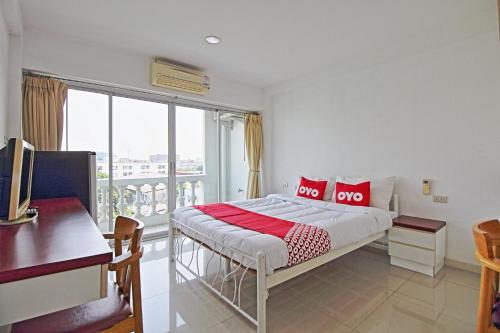 Voodi või voodid majutusasutuse Super OYO 498 Ladawan Villa toas