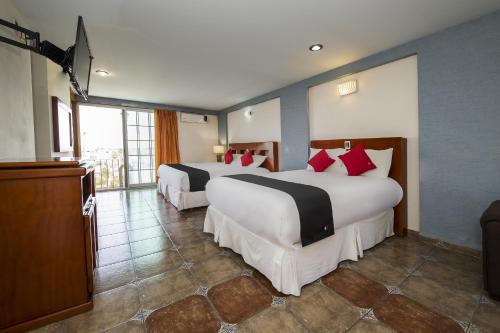Postel nebo postele na pokoji v ubytování Suites de Reyes