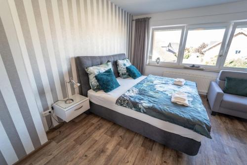 En eller flere senge i et værelse på Ferienwohnung Anke - Appartement 5c