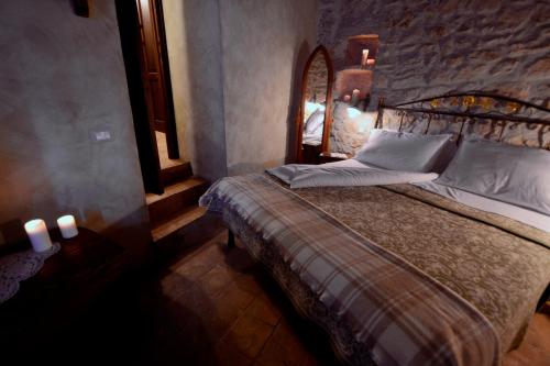 Postel nebo postele na pokoji v ubytování Robur Marsorum Albergo Diffuso
