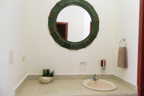 a bathroom with a sink and a mirror on the wall at Diamante Joyas Del Mar Bahia de Kino in Bahía Kino