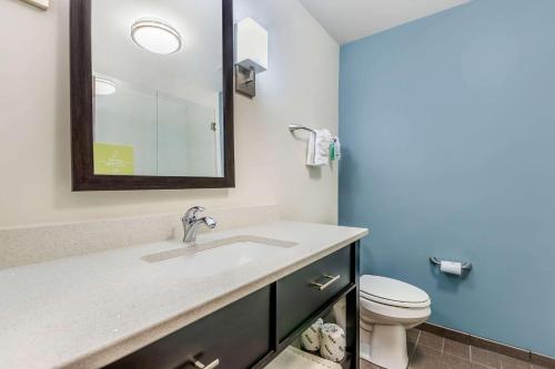 a bathroom with a sink and a toilet at Sleep Inn & Suites Ames near ISU Campus in Ames