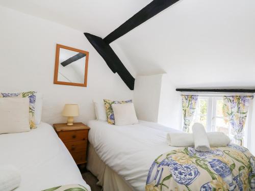 מיטה או מיטות בחדר ב-Apple Tree Cottage