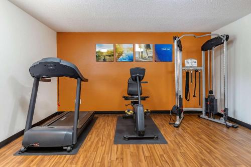 a gym with two exercise bikes and a treadmill at Comfort Inn & Suites Dimondale - Lansing in Dimondale