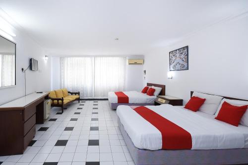เตียงในห้องที่ Super OYO 1018 Telang Usan Hotel Miri