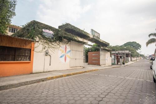 a street with a building on the side of a road at Hotel Spa Shalam in Coatepec