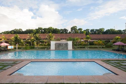 a large swimming pool in a resort yard at Bohol Beach Club in Panglao