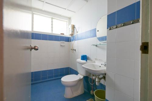 a bathroom with a toilet and a sink at JC Private Apartment Sunshine Bay in Port Dickson