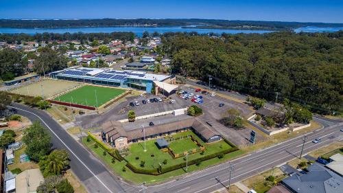 an aerial view of a building with a tennis court at Lemon Tree Passage Motel in Lemon Tree Passage