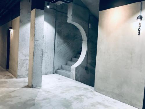 a stairway in a building with a stair case at Home Rest Hotel 2 in Taitung City