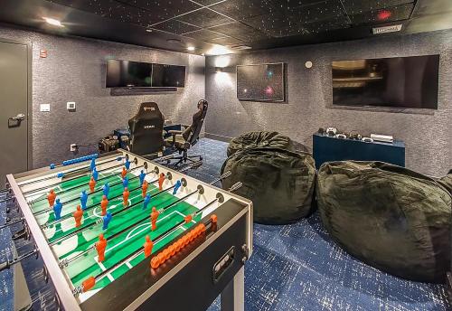 a game room with a table and a chess board at Luxury Furnished Apartments by Hyatus Downtown at Yale in New Haven