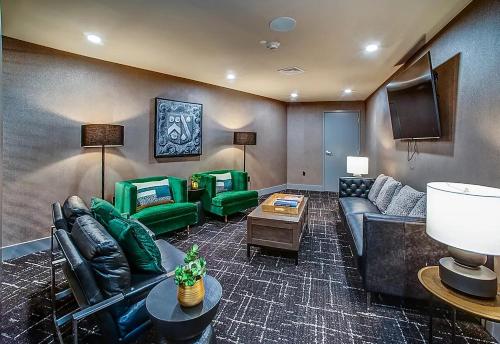 a large living room with couches and a tv at Luxury Furnished Apartments by Hyatus Downtown at Yale in New Haven