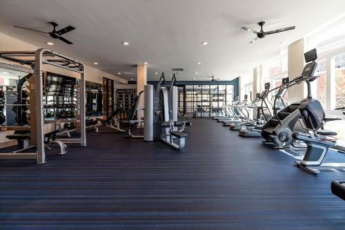a gym with lots of treadmills and machines at Luxury Furnished Apartments by Hyatus Downtown at Yale in New Haven