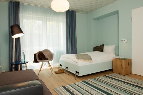 Postel nebo postele na pokoji v ubytování Hotel Gude