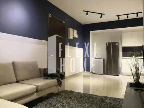 a living room with a couch and a refrigerator at Spacious Big Room, Designed & Quiet Family Home, Eclipse in Cyberjaya by Flexihome-MY in Cyberjaya
