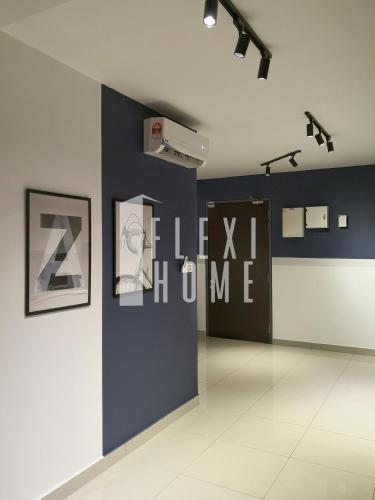a room with a blue wall with a sign on it at Spacious Big Room, Designed & Quiet Family Home, Eclipse in Cyberjaya by Flexihome-MY in Cyberjaya