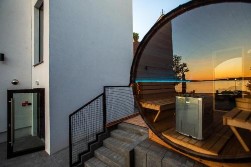 a view of a balcony with a table and a bench at OTTON-Charzykowy Bed&Restaurant in Chojnice