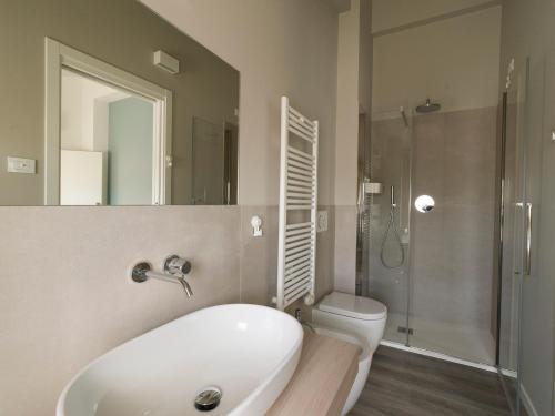 a bathroom with a sink and a toilet and a shower at Le Terre di Maluk in Monte San Vito